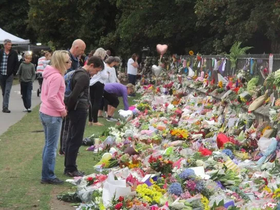 Image of Members of the public laying flowers at memorial for victims of the Christchurch mosque shootings