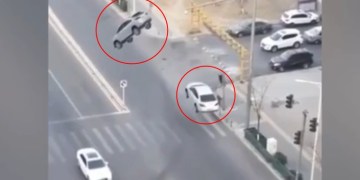 Image about Two Cars Levitated Into Air While On Middle of Busy Road