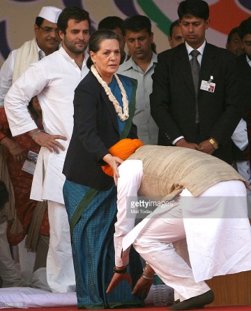 Image about Manmohan Singh Touching Sonia Gandhi's Feet, Photograph