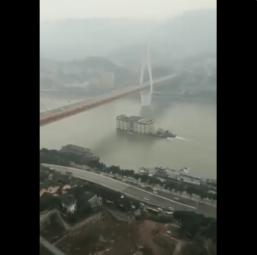 Image from Video of Building Floating Down River in China