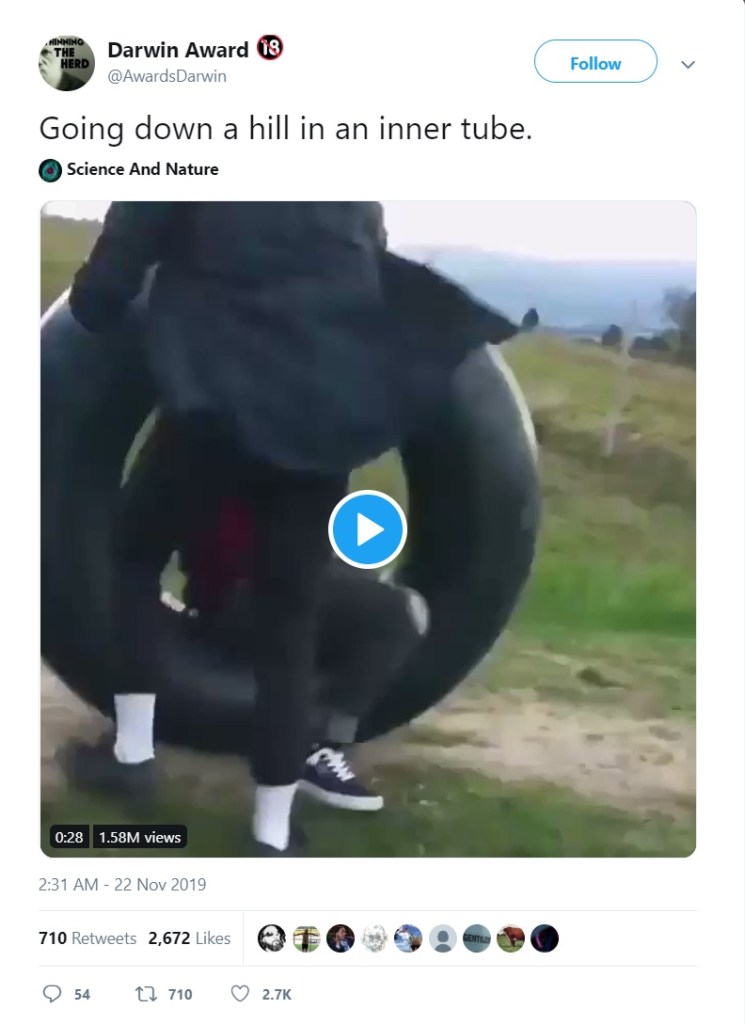 Image about Guy Rolls Down Hill in Tire Towards Car, Video