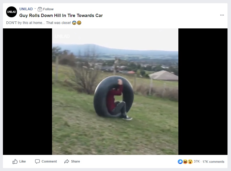 Image about Guy Rolls Down Hill in Tire Towards Car, Video