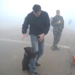 Image about Baby Bear Hugging Rescue Ranger Post Forest Fire