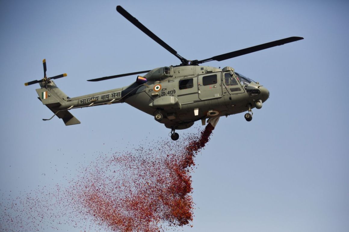 Image of IAF Helicopter spraying flower petals above Rajpath during Republic Day on 26th Jan. 2018