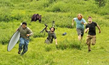 Image about Bear Chases National Geographic Crew During Filming