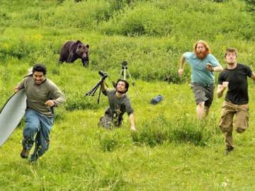 Image about Bear Chases National Geographic Crew During Filming